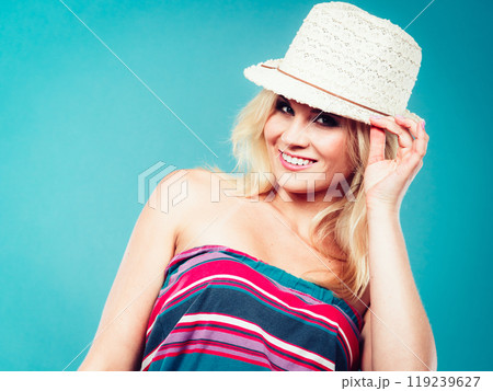 Blonde woman wearing colorful striped strapless shirt 119239627