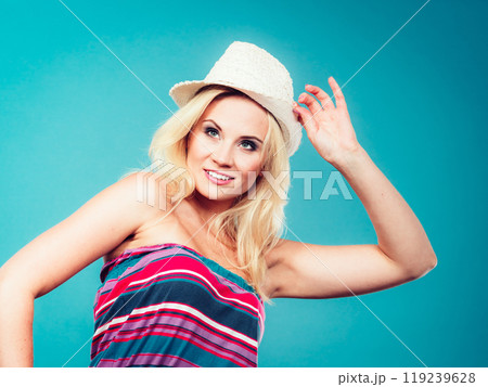 Blonde woman wearing colorful striped strapless shirt 119239628