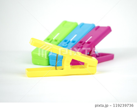 A collection of brightly colored clothespins is neatly arranged A collection of brightly colored clothespins is neatly arranged 119239736