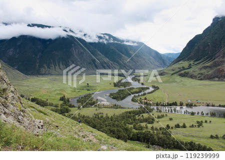 Picturesque green Chulyshman River Valley, Altai Republic, Russia. Summertime natural landscape, mountains in the clouds Picturesque green Chulyshman River Valley, Altai Republic, Russia. Summertime natural landscape, mountains in the clouds 119239999