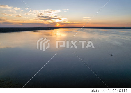 Aerial drone view over sunrise White Lake. Rivne region, Ukraine. 119240111