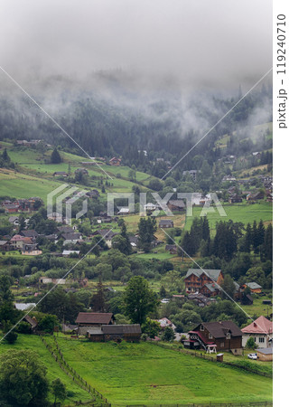 Misty morning in Vorokhta village with scenic view of Carpathian hills and fog-covered mountains Misty morning in Vorokhta village with scenic view of Carpathian hills and fog-covered mountains 119240710