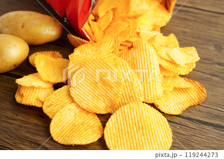 Potato chips , delicious BBQ seasoning spicy for crips, thin slice deep fried snack fast food. Potato chips , delicious BBQ seasoning spicy for crips, thin slice deep fried snack fast food. 119244273