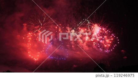 Red Firework celebrate anniversary in night time celebrate national holiday. Happy new year 2024, 4th of july holiday festival. Red firework Countdown to new year 2024 festival party time event 119246975