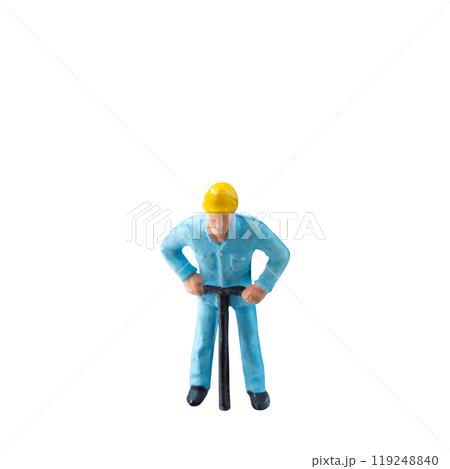 Miniature construction worker in a blue uniform isolate on white background with clipping path 119248840