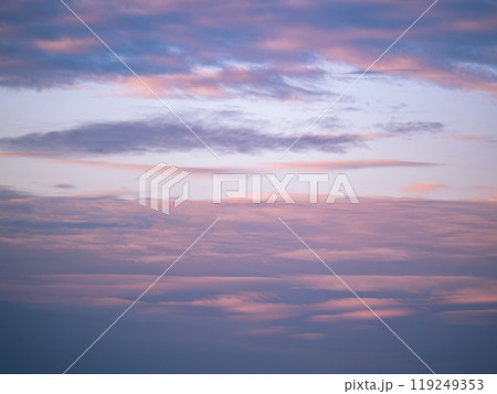 Beautiful blue evening sky with various fluffy clouds and pink orange sunset sunrise background texture Beautiful blue evening sky with various fluffy clouds and pink orange sunset sunrise background texture 119249353