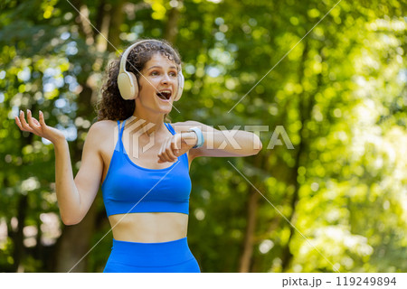 Athletic fitness sport runner woman finishing racing competition victory success workout cardio Athletic fitness sport runner woman finishing racing competition victory success workout cardio 119249894