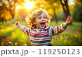 Portrait of happy child. Funny kid outdoor in park. 119250123