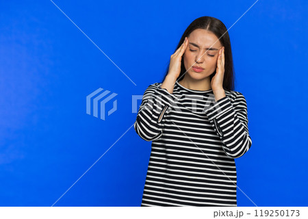 Young woman rubbing temples to cure headache problem, suffering from tension, migraine stress pain Young woman rubbing temples to cure headache problem, suffering from tension, migraine stress pain 119250173