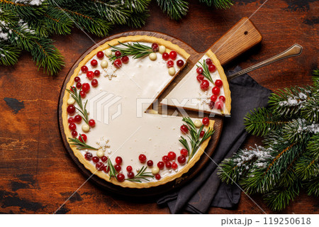 Christmas cake adorned with berries and rosemary Christmas cake adorned with berries and rosemary 119250618