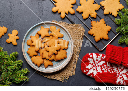 Gingerbread cookies and fir tree branch Gingerbread cookies and fir tree branch 119250776