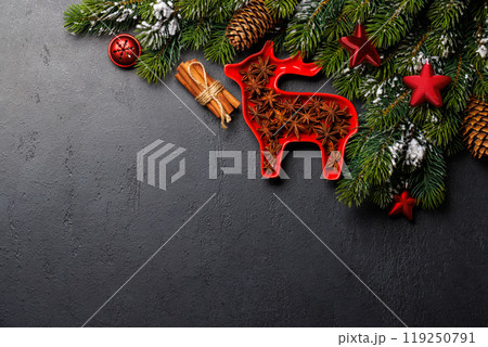 Christmas background with fir tree, decor, nuts, and copy space for greetings 119250791