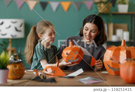Happy family preparing for Halloween. Happy family preparing for Halloween. 119251415