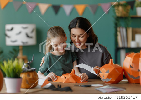Happy family preparing for Halloween. Happy family preparing for Halloween. 119251417