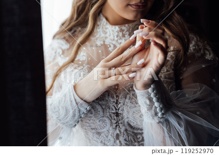 A tender bride strokes her body with her hands and sensually touches her skin. Sensual moment A tender bride strokes her body with her hands and sensually touches her skin. Sensual moment 119252970