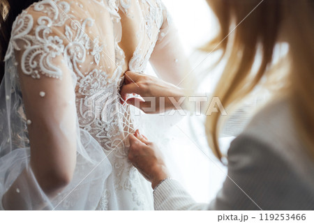 Bride and bridesmaids during the wedding preparations 119253466