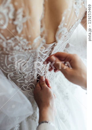Bride and bridesmaids during the wedding preparations Bride and bridesmaids during the wedding preparations 119253469