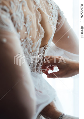 Bride and bridesmaids during the wedding preparations Bride and bridesmaids during the wedding preparations 119253470