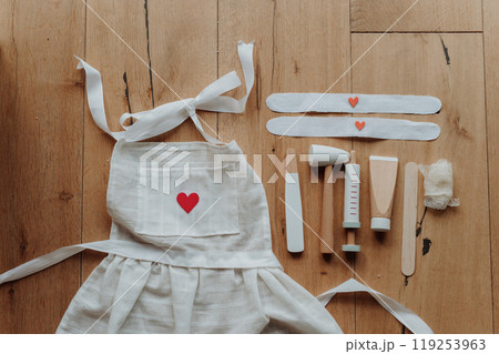 Imaginative play for children, playing hospital. Toys and equipment for little doctors. 119253963
