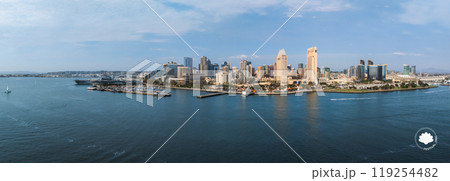 San Diego's skyline features skyscrapers like One America Plaza and Manchester Grand Hyatt. The San Diego Bay, with boats and the USS Midway, is visible. San Diego's skyline features skyscrapers like One America Plaza and Manchester Grand Hyatt. The San Diego Bay, with boats and the USS Midway, is visible. 119254482