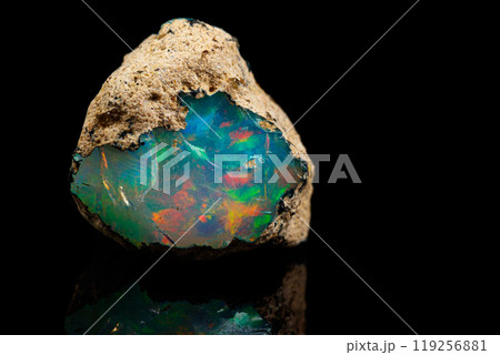 macro mineral stone rare and beautiful opals on a black background 119256881