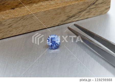 macro mineral faceted stone Sapphire on a gray background 119256988