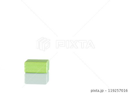 Wooden cube of green color on a white background Wooden cube of green color on a white background 119257016