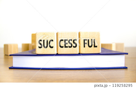 Successful symbol. Concept word Successful on beautiful wooden blocks. Beautiful wooden table white background. Beautiful book. Business successful concept. Copy space. Successful symbol. Concept word Successful on beautiful wooden blocks. Beautiful wooden table white background. Beautiful book. Business successful concept. Copy space. 119258295