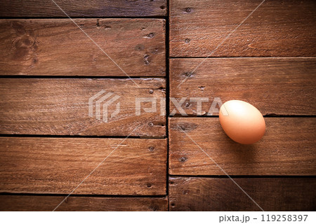 Egg on a rustic wooden board Egg on a rustic wooden board 119258397
