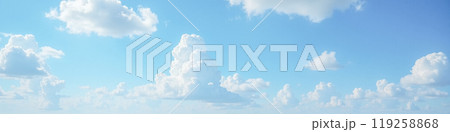 Expansive blue sky with soft white cumulus clouds scattered across, tranquil daylight scene for calm mood setting in creative projects, natural atmospheric environment for graphic element 119258868