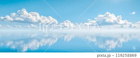 Perfect reflection of white clouds on still water, clear blue sky over calm lake, peaceful natural landscape, symmetrical cloud reflection in water Perfect reflection of white clouds on still water, clear blue sky over calm lake, peaceful natural landscape, symmetrical cloud reflection in water 119258869
