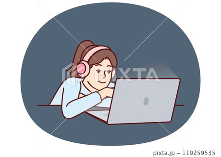 Little girl in headphones uses laptop watching children series or internet show for schoolchildren 119259535