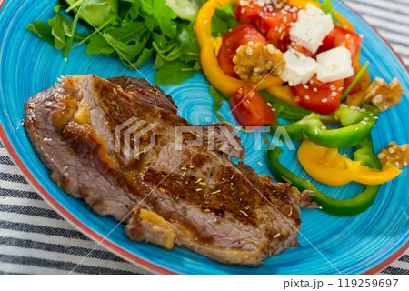 Roasted veal steak with salad 119259697