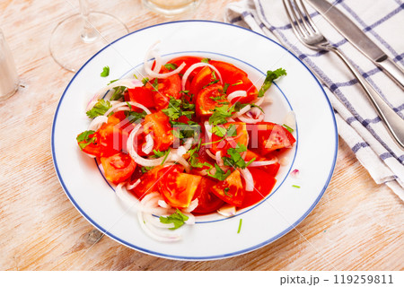 Vegetarian salad with tomatoes, onion, greens and olive oil Vegetarian salad with tomatoes, onion, greens and olive oil 119259811