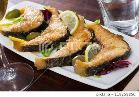 Slices of fried in flour sturgeon 119259856