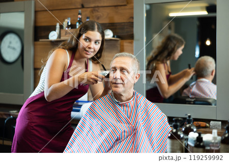 Master barber does the hairstyle and styling. Concept barbershop 119259992