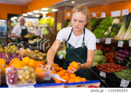 Girl at her first job in vegetable shop Girl at her first job in vegetable shop 119260263