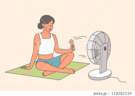 Electric fan blows on woman eating ice cream, sitting on floor in hot weather during summer season Electric fan blows on woman eating ice cream, sitting on floor in hot weather during summer season 119262134