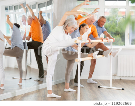 Ballet pose grand batman - elderly women and men at choreography lesson 119262669