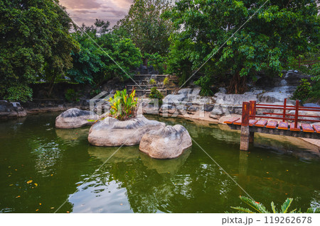 Japanese pond with bridge in the park in garden at the Buddhist pagoda in summer in Asia 119262678