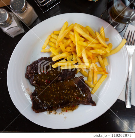 Veal steak in chimichurri sauce Veal steak in chimichurri sauce 119262975