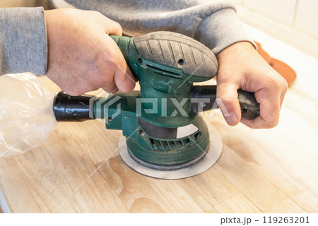 Work with a grinder on wood. Work tool. Work with a grinder on wood. Work tool. 119263201
