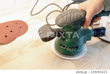 Work with a grinder on wood. Work tool. 119263221