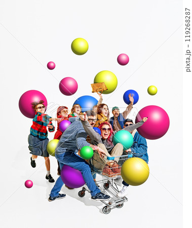Packed shopping cart full of people surrounded by large colorful balls. Shoppers ride in excitement for the best Black Friday deals. Creative colorful collage. Packed shopping cart full of people surrounded by large colorful balls. Shoppers ride in excitement for the best Black Friday deals. Creative colorful collage. 119268287