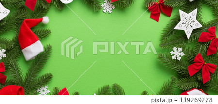 Christmas decorations and fir tree branch and gift boxon dark table. Top view frame with copy space 119269278