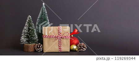 Christmas composition. Gifts, small tree, branches and craft DIY decorations on white background. New year concept. Christmas home decoration Flat lay, top view, copy space 119269344