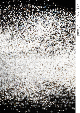 Abstract black and white background of pouring flour, space for text Abstract black and white background of pouring flour, space for text 119270157