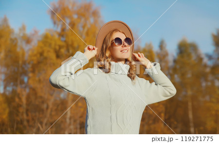 Happy stylish smiling woman in autumn park, joyful girl enjoying warm sunny weather, fall season Happy stylish smiling woman in autumn park, joyful girl enjoying warm sunny weather, fall season 119271775