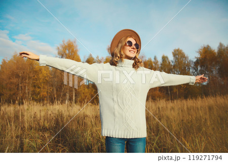 Stylish modern happy young woman having fun dancing, fashionable girl smiling outdoors, autumn park Stylish modern happy young woman having fun dancing, fashionable girl smiling outdoors, autumn park 119271794