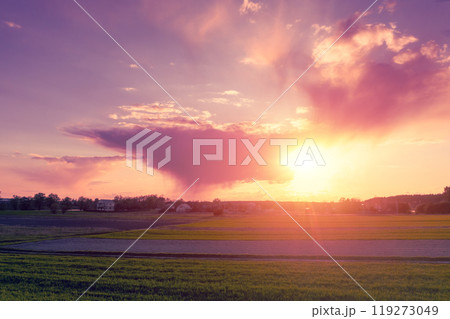 Sunset in the countryside. Dramatic sky over the farmland 119273049
